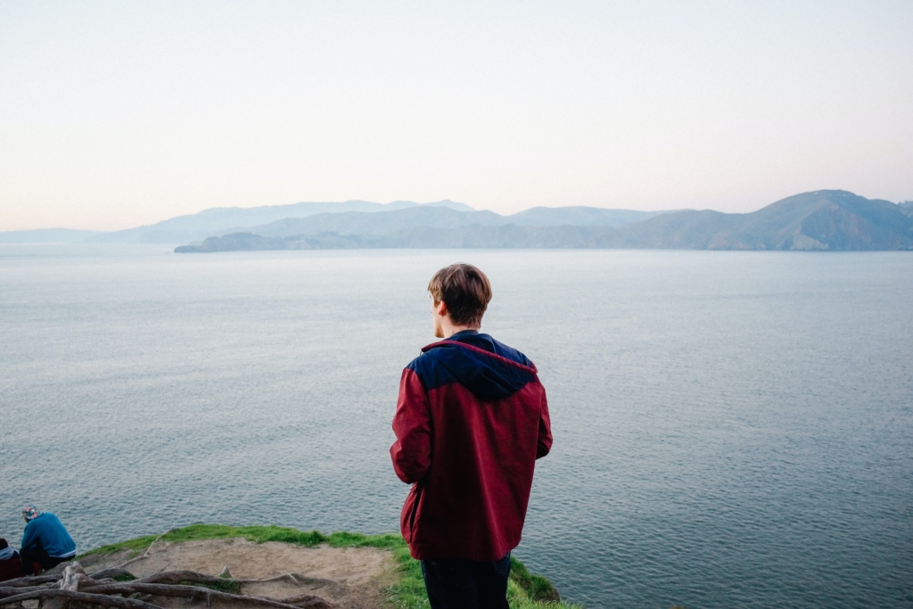 man standing on cliff